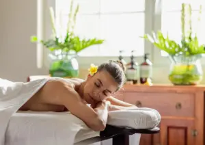 Woman resting peacefully after a traditional Balinese massage for stress relief and better sleep at Akoya Spa Ubud Bali